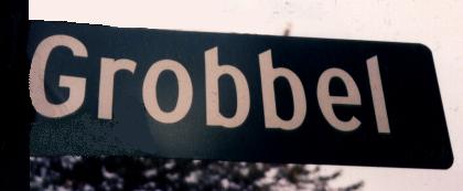 Street sign at the corner of 12 Mile Rd. and Grobbel Drive